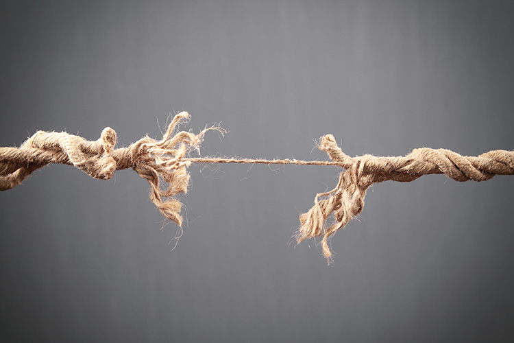 Frayed,Rope,About,To,Break,On,Grey,Background.,Risk